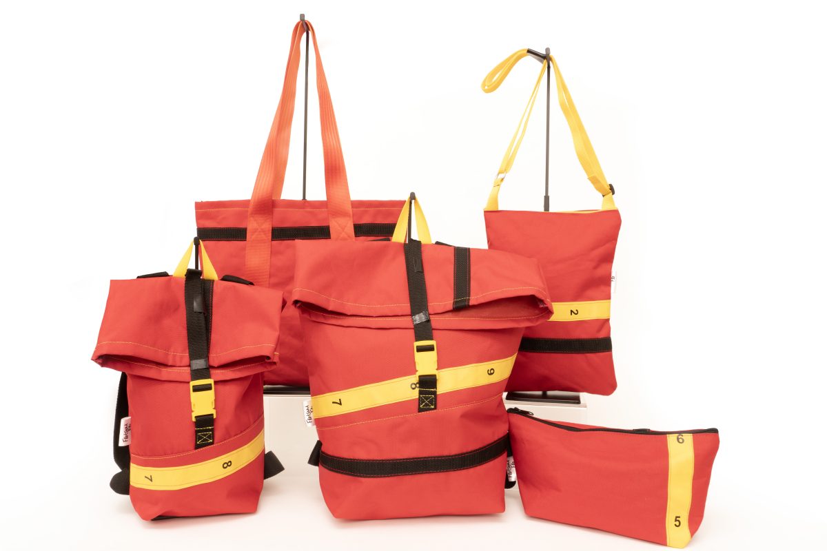 Red bags with black, green and orange straps.
