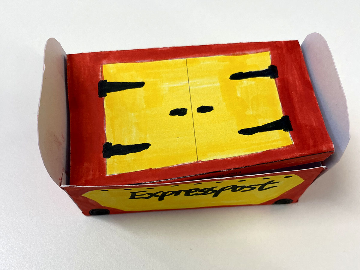 A red and yellow paper model of a Mail Rail York container.
